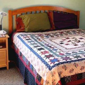 Image of a bed quilt handmade by Two Sisters Quilt Company