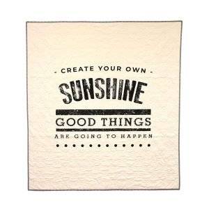 cream colored inspirational quilt with the saying, Create your own sunshine, good things are going to happen