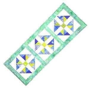 uplifting table runner featuring blue and green fabrics