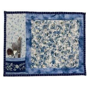 blue quilted placemat set with a pocket that holds silverware