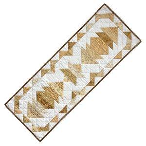 elegant quilted table runner featuring white and gold fabrics