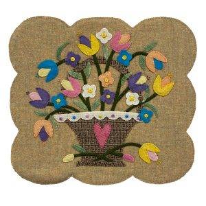 wool table centerpiece with hand embroidered basket and flowers