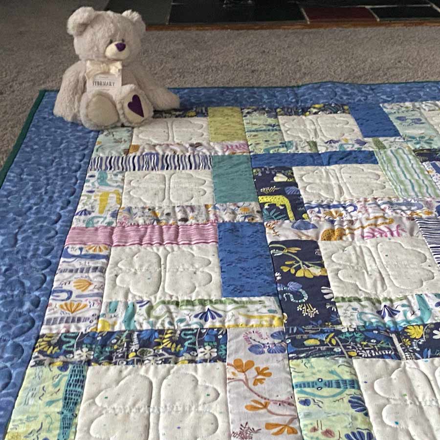 Happy Day baby's quilt with teddy bear