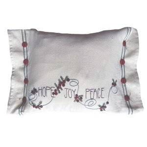 Celebrate the Christmas season with our hand-embroidered "hope, Joy, Peace" word art pillow