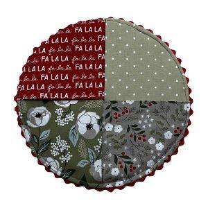 round mug rug that features Christmas themed fabrics