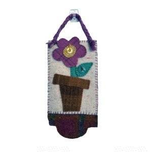 Hand embroidered wool fabric door hanger of a potted purple flower with accent buttons