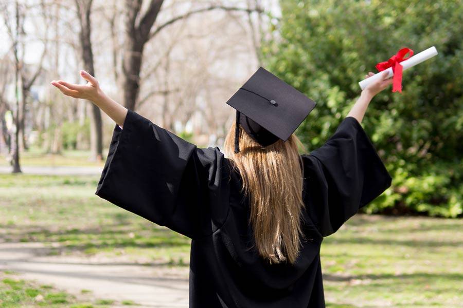 girl graduating with diploma