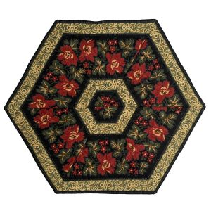 Cotton table topper with a kaleidoscope effect of stylized red peonies radiating from the center