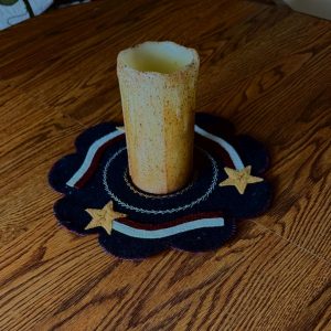 American Candle Mat, blue 11" diameter mat with 3 yellow stars and red, white stripes