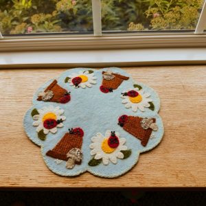Flowerpots & Ladybugs Wool Mat blue background with white and yellow daisies brown flowerpots and mushrooms with red and black lady bugs