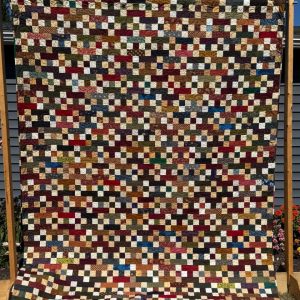 Stacked Blocks Quilt squares and rectangles in a rainbow of colors stitched together