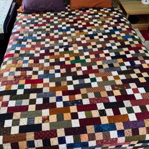 Stacked Blocks Quilt squares and rectangles in a rainbow of colors stitched together