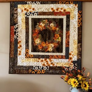 "Fall Wreath" Wall Quilt 42 x 42, pumpkins, leaves and sunflowers in oranges, browns, reds, yellows, tans and greens