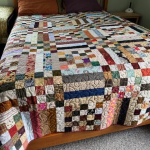 Posts & Rails quilt kit. Simple quilt is made from squares and rectangles using scrap pieces of fabric in various colors.
