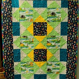 "It’s a Jungle In Here!" Couch Quilt 51 x 61 in green, yellow, blue, orange and grey with sun, elephants, fish, water and grass