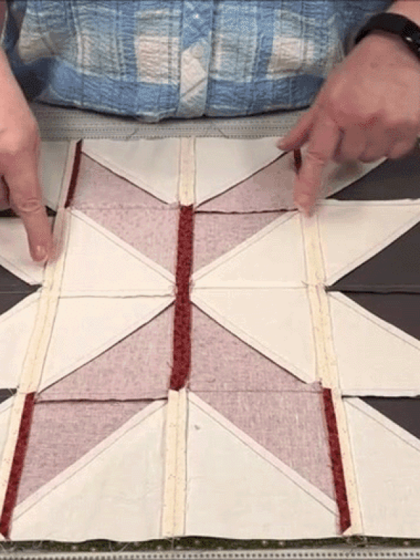Piecing together quilt blocks